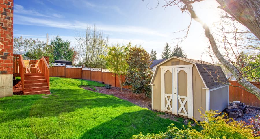 Fenced backyard with storage shed in Beaumont